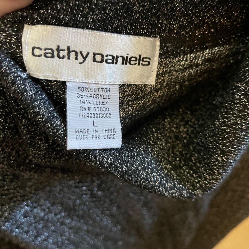 Very elegant light sweater like garment. Black and silver. Smoke free & pet free